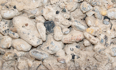 concrete wall with stones