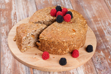 pie with orange and nuts, decorated berry