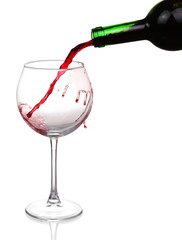 Obraz na płótnie Canvas Red wine pouring on white background