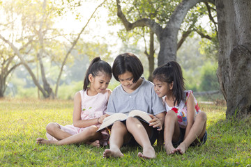 Three girls reading.