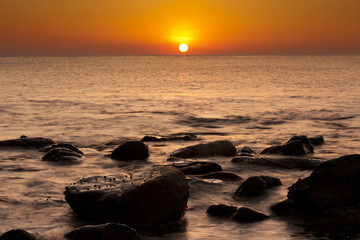 Fototapeta na wymiar Beautiful serene sunrise in Al Aqqa beach, Fujairah, UAE