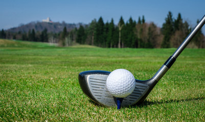 chipping a golf ball onto the green with golf club