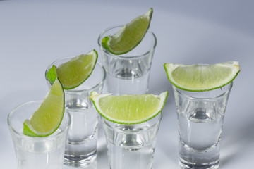 Tequila in glass on white