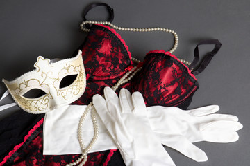 sexy female lingerie, mask and gloves on grey