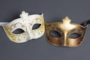 two beautiful carnival masks on grey