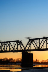 Fototapeta premium Railroad bridge and construction site on river bank 