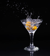Vermouth cocktail inside martini glass over dark background