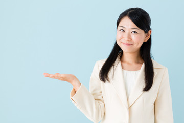 asian businesswoman on blue background