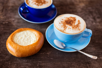 Coffee and cake on a wooden table background
