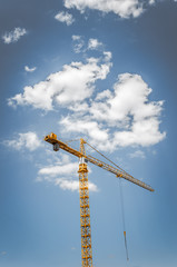 Crane on blue sky.