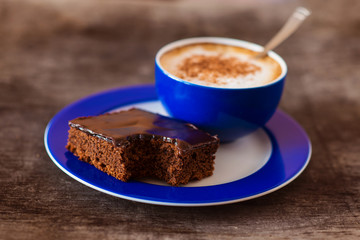 Coffee and cake on a wooden table background