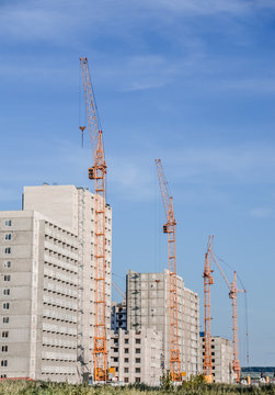 Apartment buildings with cranes
