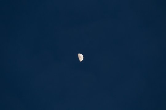 Half moon on dark sky background