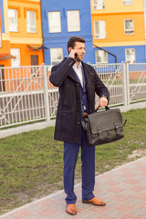 Fototapeta premium Businessman talking on mobile phone