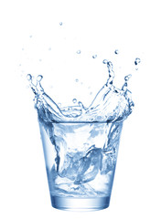 Fototapeta na wymiar Ice splashing in cup of water