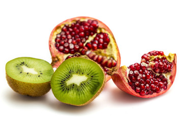 Pomegranate and Kiwi fruit isolated on white background