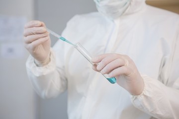 Scientist injecting tube