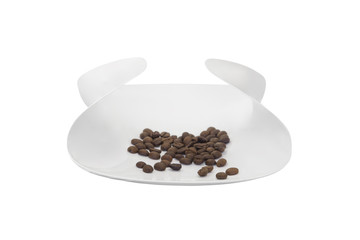 coffee beans on a plate isolated on white background