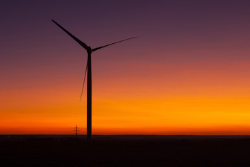 Fototapeta na wymiar Windfarm at sunset and sky with dust from volcano