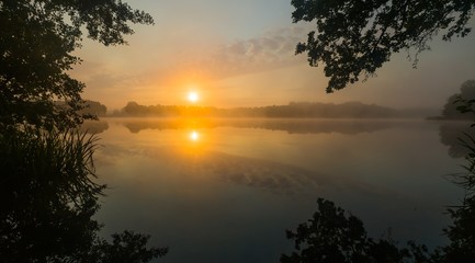 Fototapeta na wymiar Lake sunrise in summer