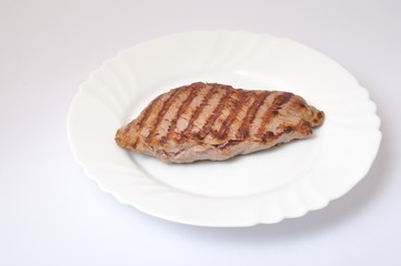 Grilled beef steak on plate