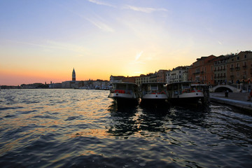 Venetian sunset and boats near San-Marco