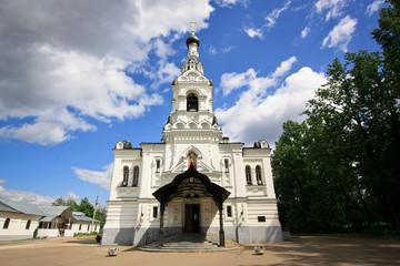 Fototapeta na wymiar White church on the background of blue sky