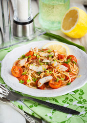 Fresh delicious pasta with fish and tomato sauce