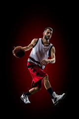 Fototapeta na wymiar Basketball player in action is flying high