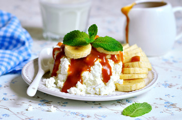 Cottage cheese with banana and caramel sauce.