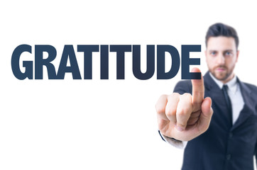Business man pointing the text: Gratitude