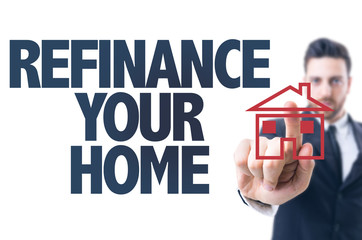 Business man pointing the text: Refinance Your Home