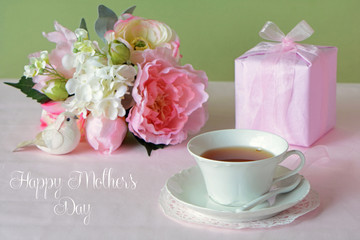 Mother's Day  flowers with gift and cup of tea