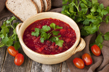 Borscht, beetroot soup with bread and parslay