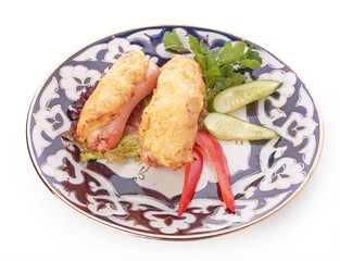 pile of chicken nuggets on white plate with sauce