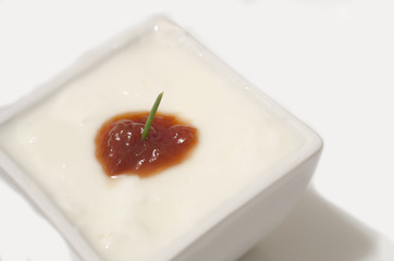 Yogurt with jam on white