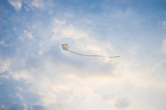 Kite flying high in the wind.