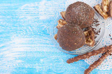 Cupcake with chocolate on wooden background