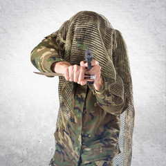 Soldier shooting with a pistol