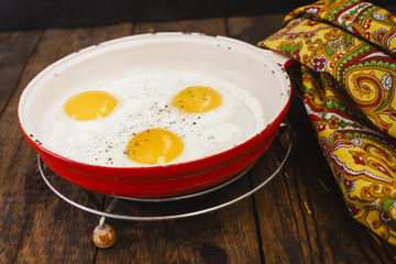 fried eggs in a frying pan