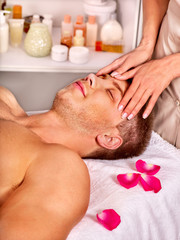 Obraz na płótnie Canvas Man getting facial massage .