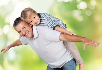 Father. Man and young boy playing outdoors