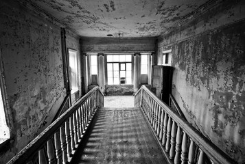 Black and white staircase in the abandoned estate