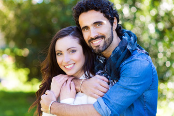 Close up portrait of attractive young couple in love outdoors