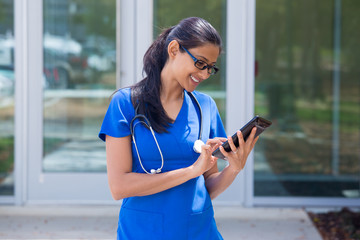Healthcare worker working on digital tablet