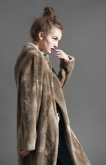 fashion woman in  brown fur coat pose - 81573207