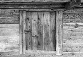 Wooden door into ancient rustic barn