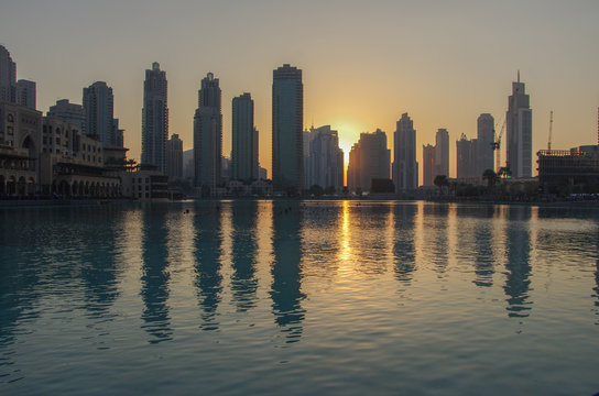 Dubai sunset in front of the artificial lake outside the Dubai M