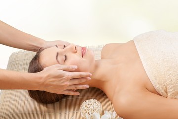 Obraz na płótnie Canvas Spa. Young attractive woman getting spa treatment over white