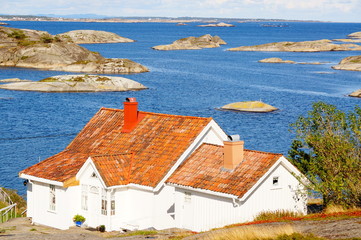 Traditional norwegian summer house by the sea